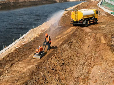 Plate compactors on embankment